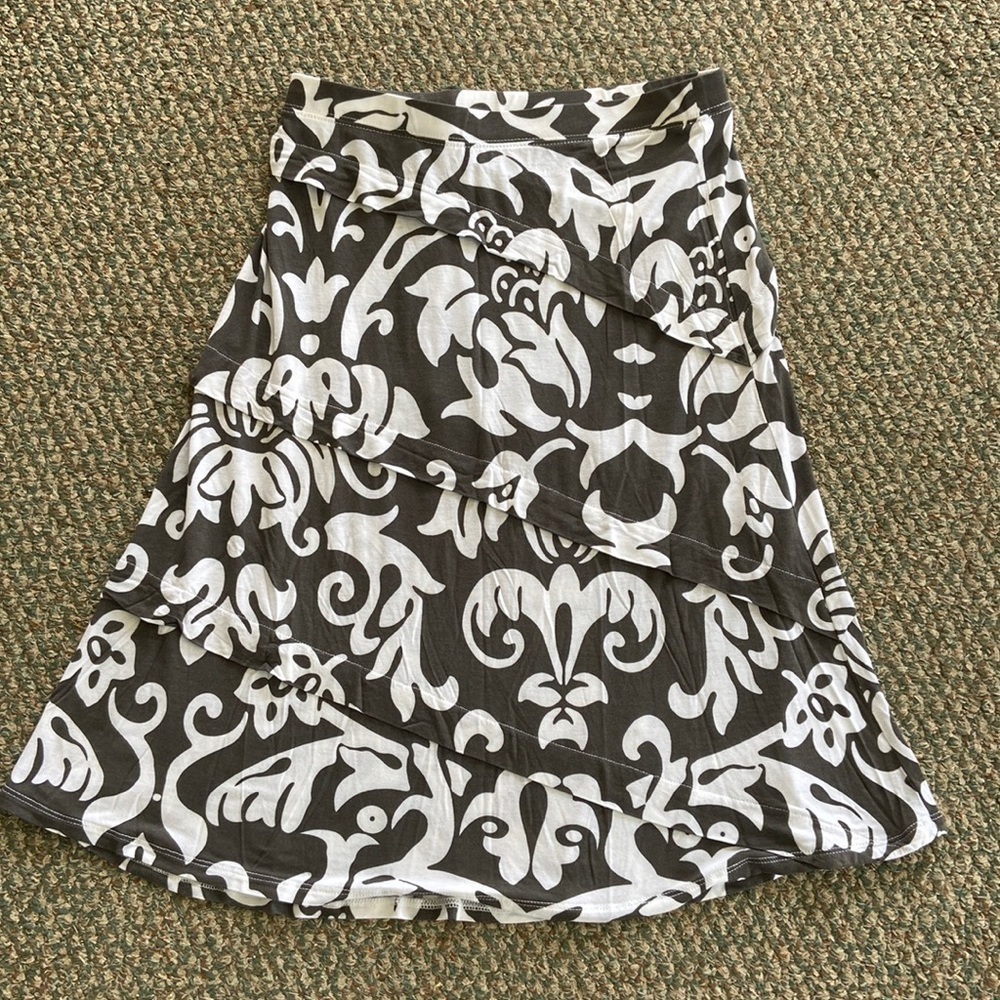 INC a line calf length skirt. Dark gray and white print and 100% rayon